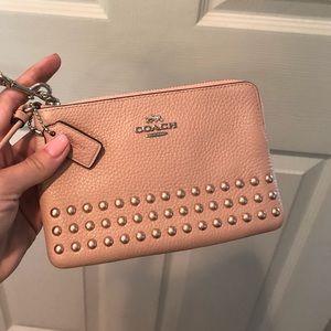 Small pink Coach wristlet